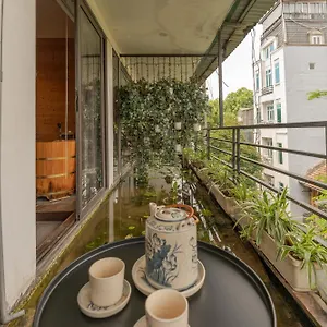 Pagodaview2-lotuspond-woodenbathtub